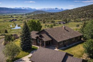 Summit West Contracting brown shingles roof big country house
