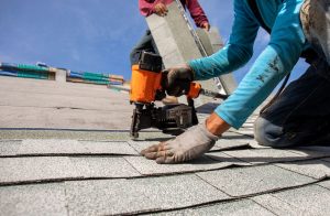 roofers installing new shingles